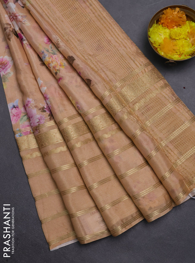 Semi georgette saree orange with allover floral prints and long zari woven border
