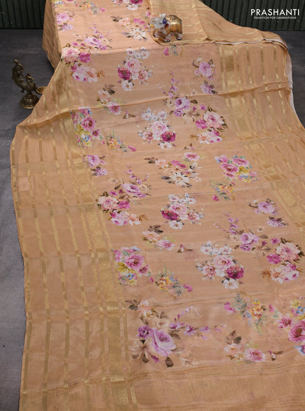 Semi georgette saree orange with allover floral prints and long zari woven border
