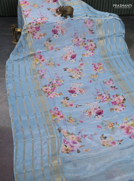 Semi georgette saree pastel blue with allover floral prints and long zari woven border