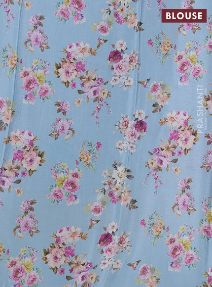 Semi georgette saree pastel blue with allover floral prints and long zari woven border
