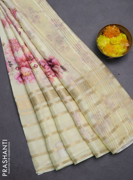 Semi georgette saree pale yellow with allover floral prints and long zari woven border
