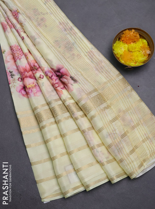 Semi georgette saree pale yellow with allover floral prints and long zari woven border