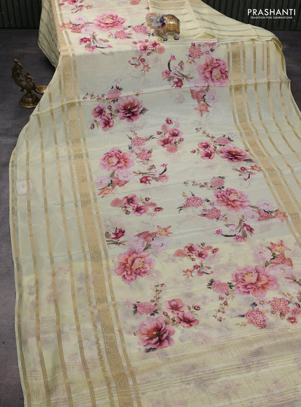 Semi georgette saree pale yellow with allover floral prints and long zari woven border