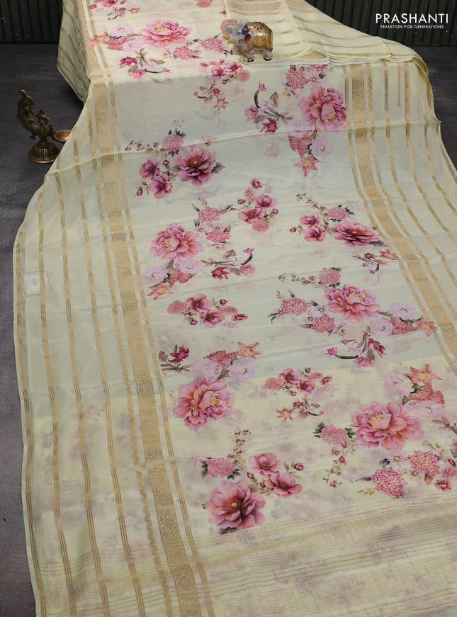 Semi georgette saree pale yellow with allover floral prints and long zari woven border