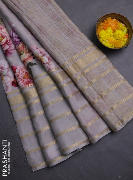 Semi georgette saree grey with allover floral prints and long zari woven border