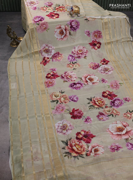 Semi georgette saree elaichi green with allover floral prints and long zari woven border