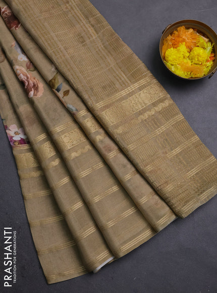 Semi georgette saree elaichi green with allover floral prints and long zari woven border