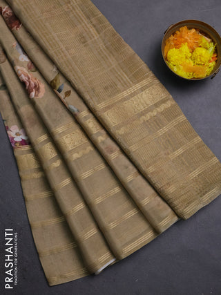 Semi georgette saree elaichi green with allover floral prints and long zari woven border