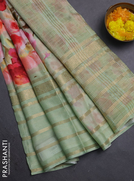 Semi georgette saree pastel green with allover floral prints and long zari woven border