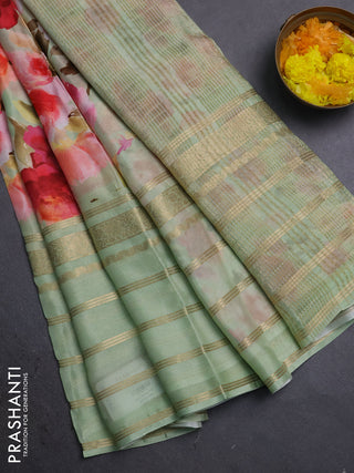 Semi georgette saree pastel green with allover floral prints and long zari woven border