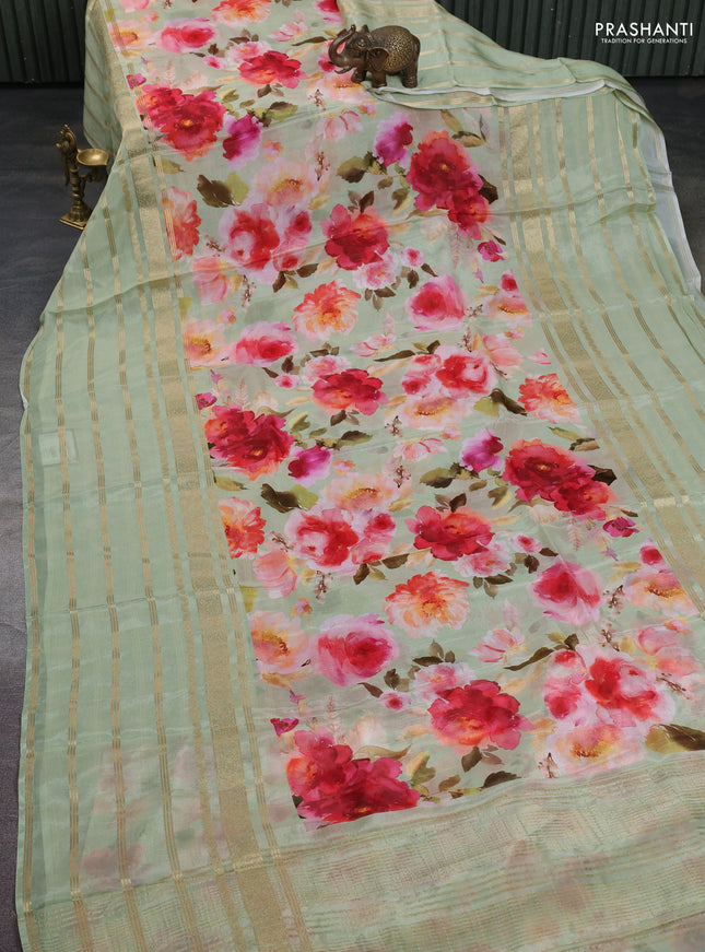 Semi georgette saree pastel green with allover floral prints and long zari woven border