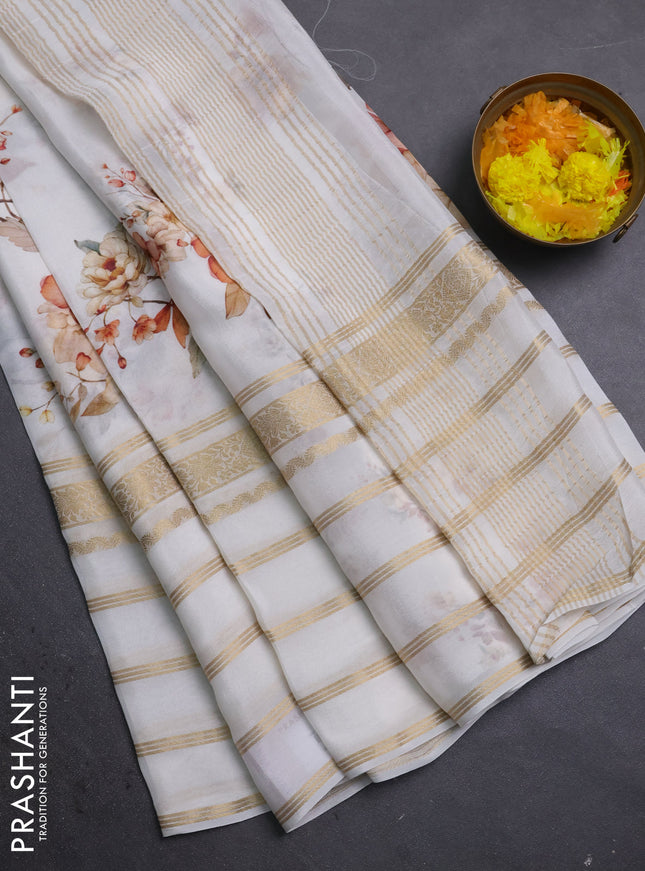 Semi georgette saree off white with allover floral prints and long zari woven border