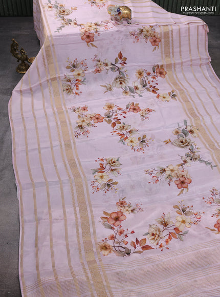 Semi georgette saree baby pink with allover floral prints and long zari woven border
