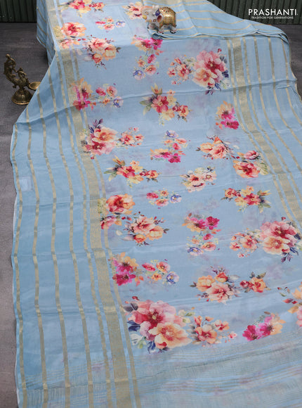 Semi georgette saree pastel blue with allover floral prints and long zari woven border