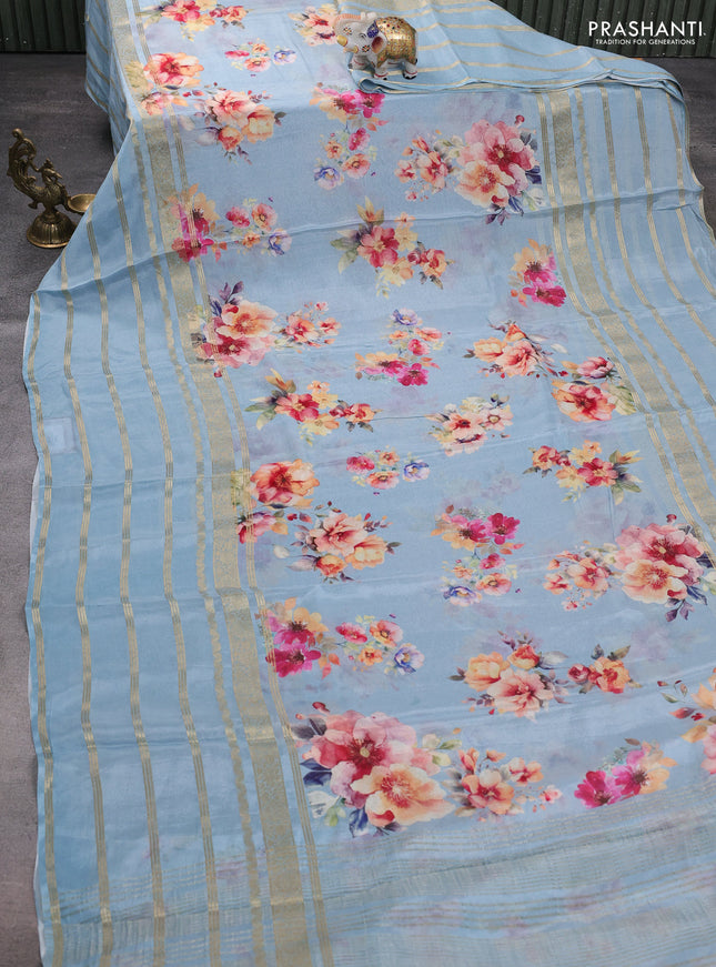 Semi georgette saree pastel blue with allover floral prints and long zari woven border