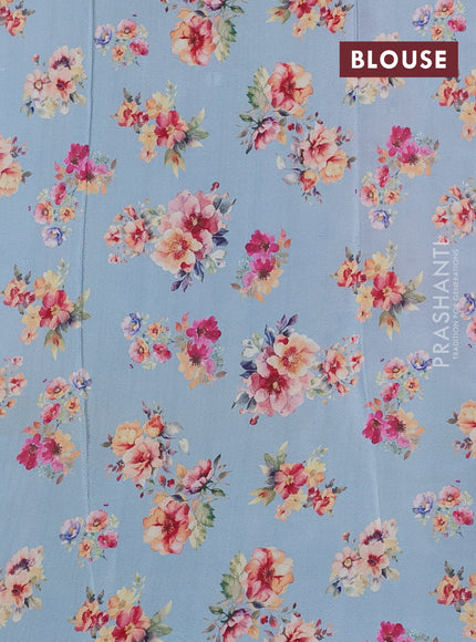 Semi georgette saree pastel blue with allover floral prints and long zari woven border