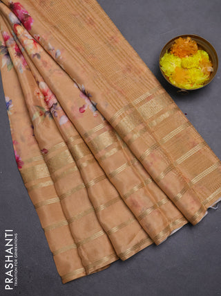 Semi georgette saree pale orange shade with allover floral prints and long zari woven border