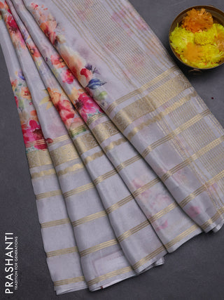 Semi georgette saree grey with allover floral prints and long zari woven border