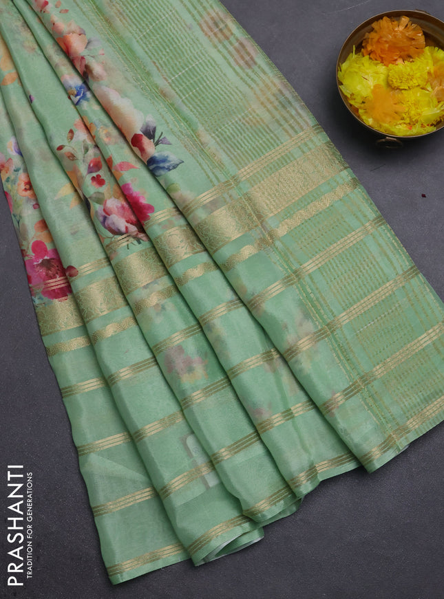 Semi georgette saree green with allover floral prints and long zari woven border