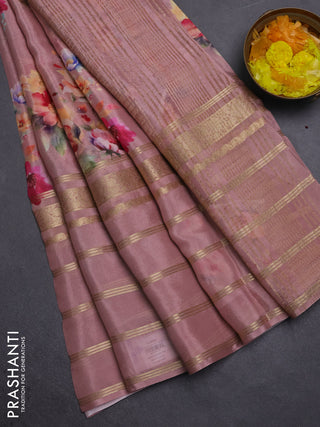 Semi georgette saree pastel peach shade with allover floral prints and long zari woven border
