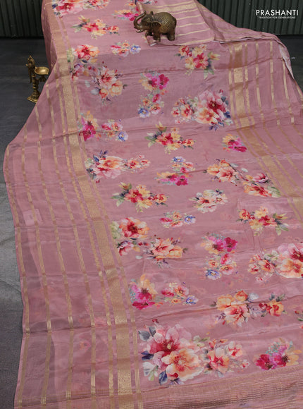 Semi georgette saree pastel peach shade with allover floral prints and long zari woven border