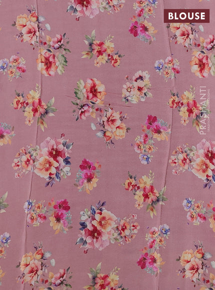 Semi georgette saree pastel peach shade with allover floral prints and long zari woven border