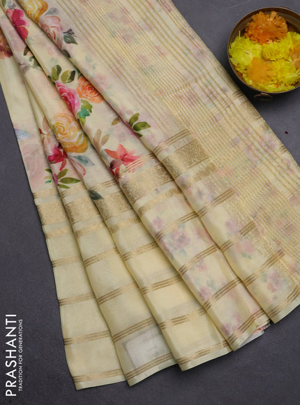Semi georgette saree pale yellow with allover floral prints and long zari woven border