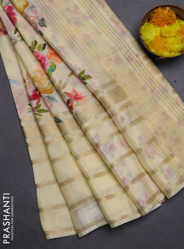 Semi georgette saree pale yellow with allover floral prints and long zari woven border