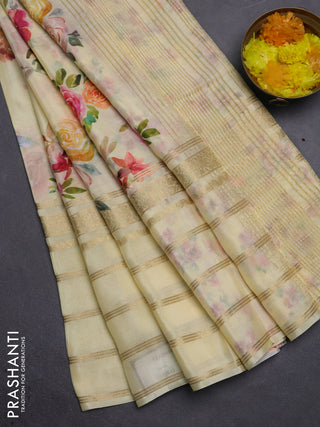 Semi georgette saree pale yellow with allover floral prints and long zari woven border