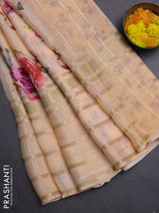 Semi georgette saree pale orange with allover floral prints and long zari woven border