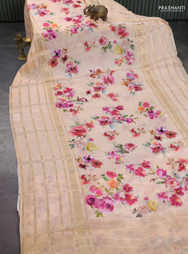 Semi georgette saree pale orange with allover floral prints and long zari woven border