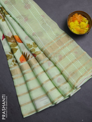 Semi georgette saree pista green with allover floral prints and long zari woven border