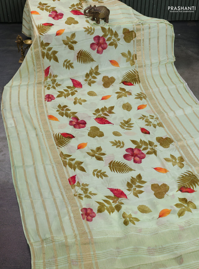 Semi georgette saree pista green with allover floral prints and long zari woven border