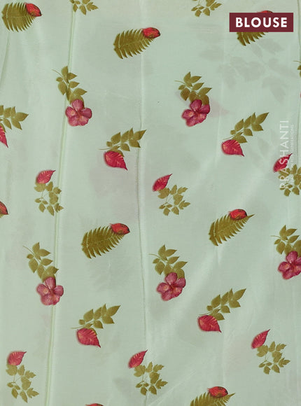 Semi georgette saree pista green with allover floral prints and long zari woven border