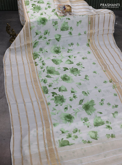 Semi georgette saree off white and green with allover floral prints and long zari woven border