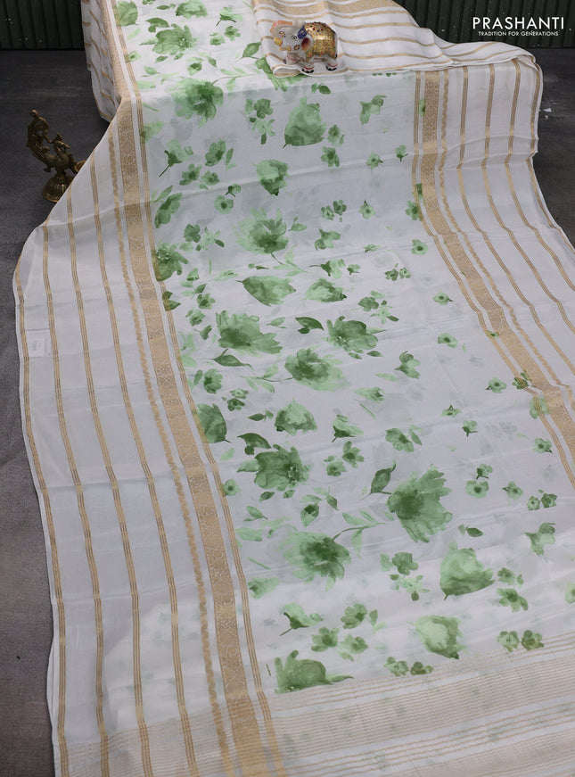 Semi georgette saree off white and green with allover floral prints and long zari woven border