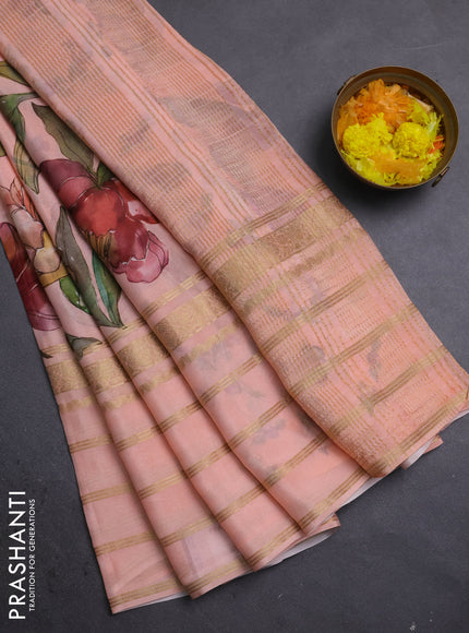 Semi georgette saree peach orange with allover floral prints and long zari woven border