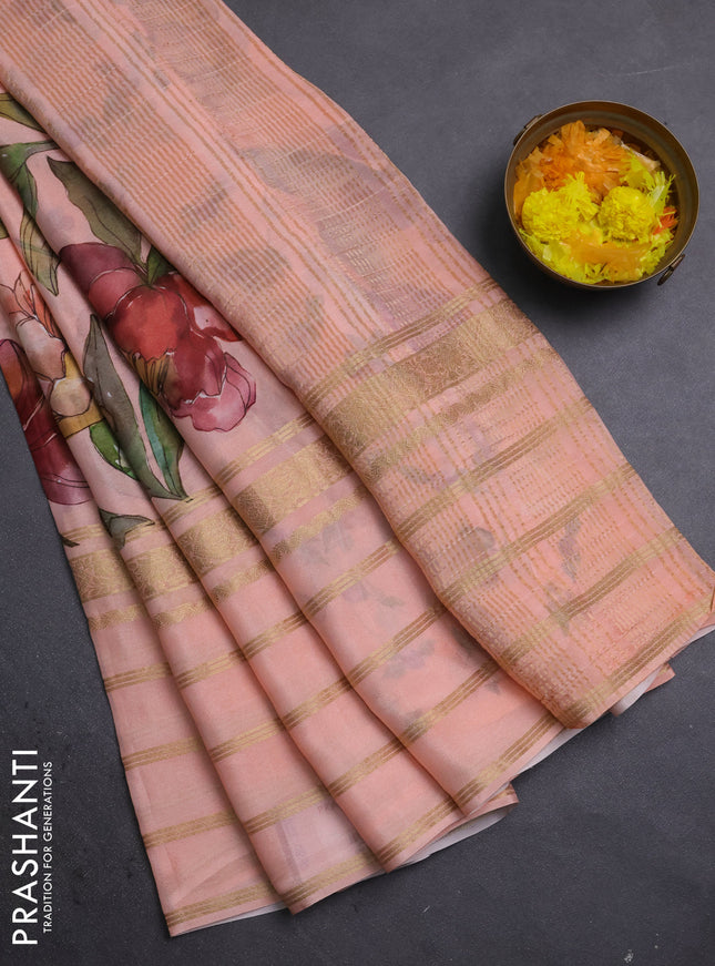 Semi georgette saree peach orange with allover floral prints and long zari woven border