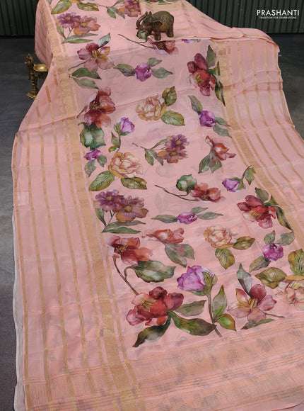 Semi georgette saree peach orange with allover floral prints and long zari woven border