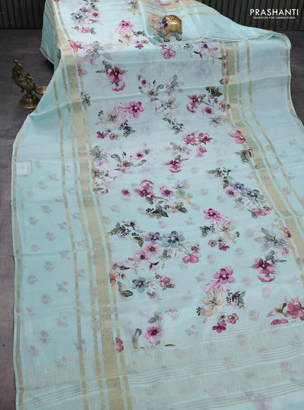 Semi georgette saree teal green shade with allover floral prints and long zari woven border