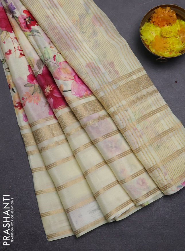 Semi georgette saree pale yellow with allover floral prints and long zari woven border