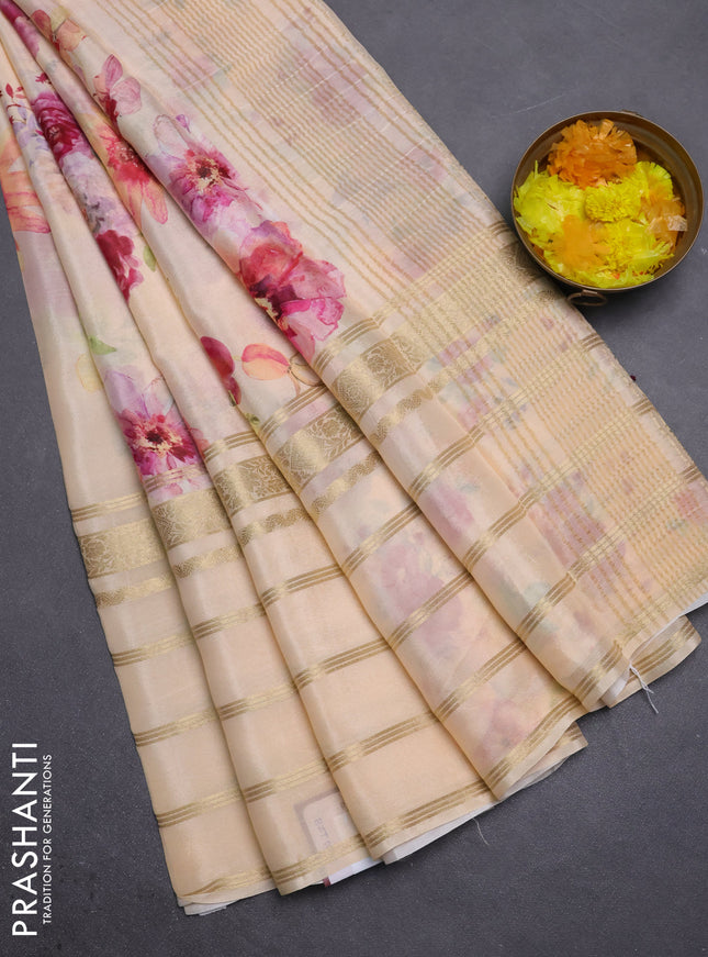 Semi georgette saree pale orange with allover floral prints and long zari woven border