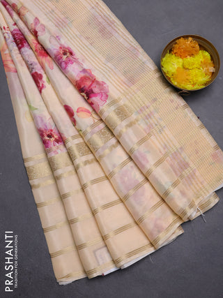 Semi georgette saree pale orange with allover floral prints and long zari woven border