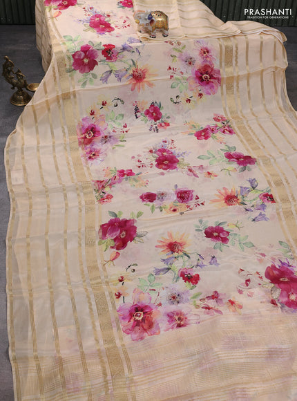 Semi georgette saree pale orange with allover floral prints and long zari woven border