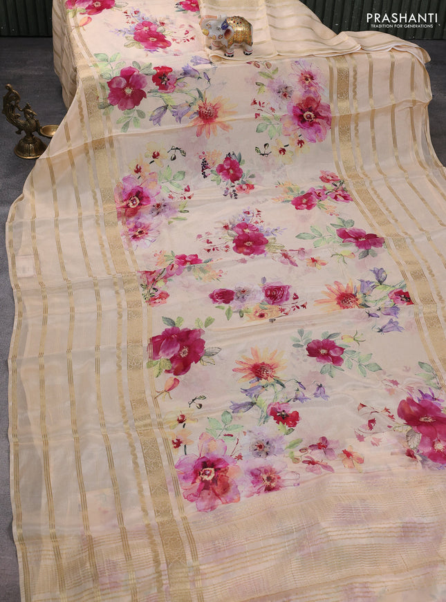 Semi georgette saree pale orange with allover floral prints and long zari woven border
