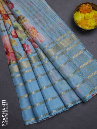 Semi georgette saree pastel blue with allover floral prints and long zari woven border