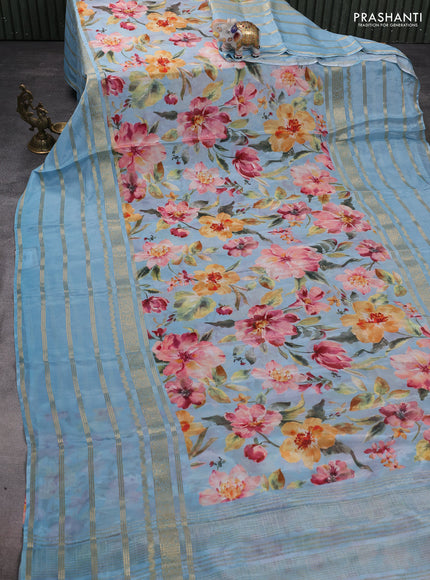 Semi georgette saree pastel blue with allover floral prints and long zari woven border