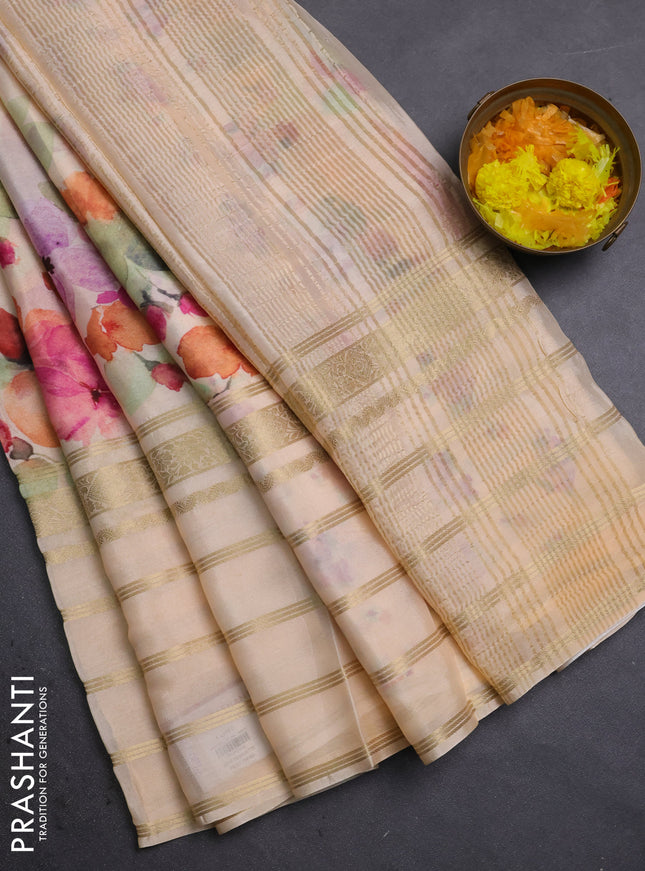 Semi georgette saree pale orange with allover floral prints and long zari woven border