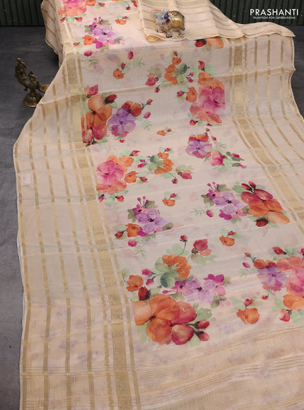 Semi georgette saree pale orange with allover floral prints and long zari woven border