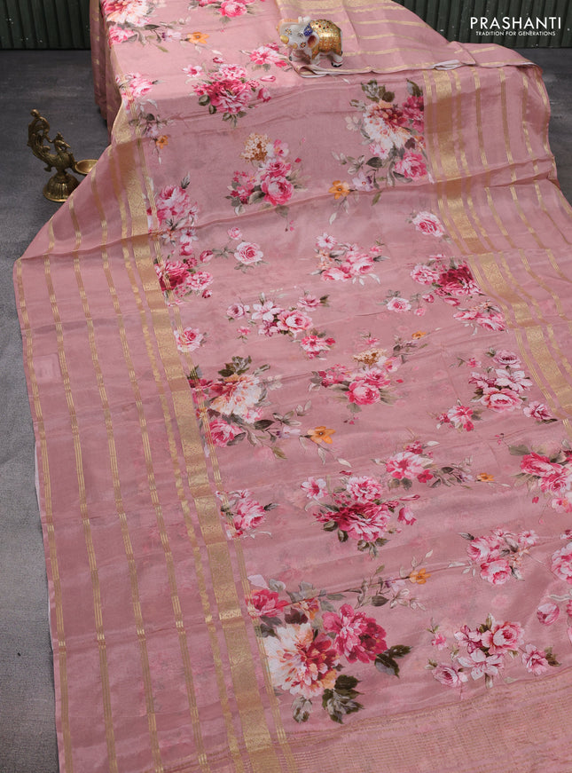 Semi georgette saree pastel peach pink with allover floral prints and long zari woven border